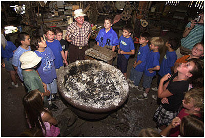 Rubel Castle. The forge inside the machine shop. Dick Macy explains how things were done.